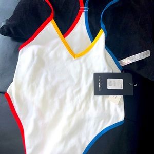 Fashion nova body suit with primary colors on the outline